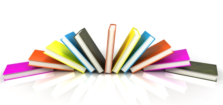 Photo of books in bright book covers splayed across a white background